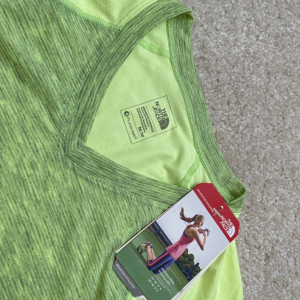 Brand new with tags. North Face moister wicking top in fluorescent yellow green.